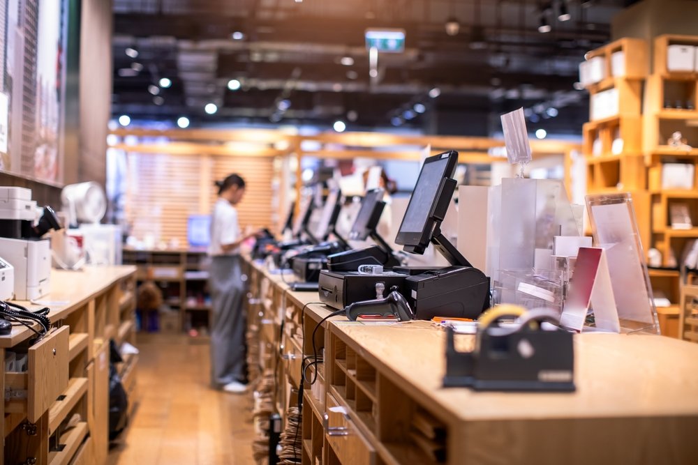 A vibrant and diverse retail marketplace with various stalls and shoppers